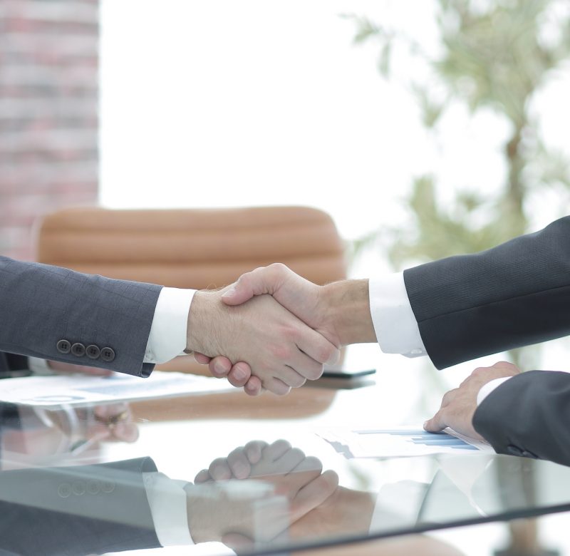 handshake of business partners on business negotiations